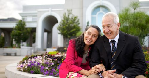 older couple in front of temple