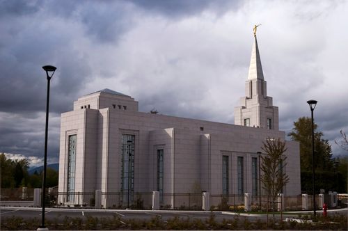 A view of the entire Vancouver British Columbia Temple from the side, with the fence surrounding the grounds.