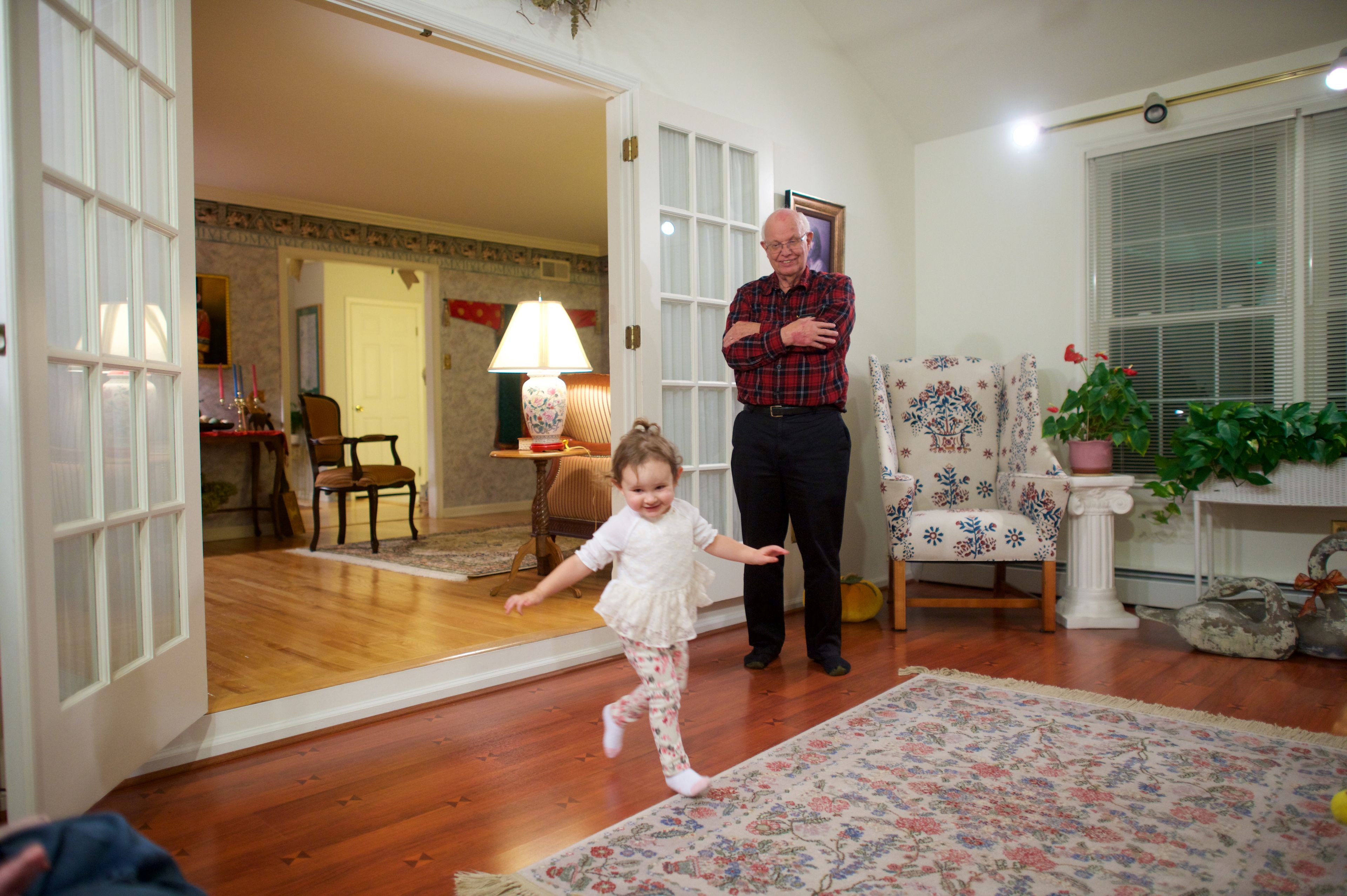 A grandfather in Pennsylvania watches over his dancing granddaughter.