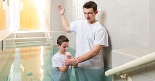 boy being baptized