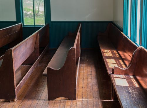 rows of benches in a church building