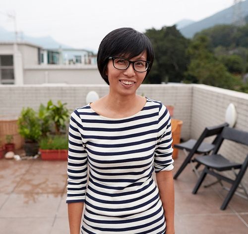 woman smiling on rooftop