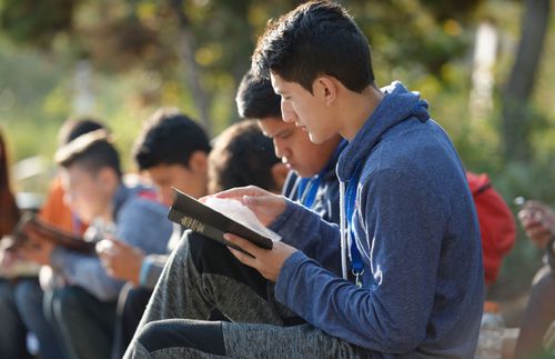 young man reading scriptures