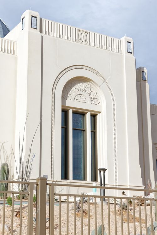 A detail shot of the Tucson Arizona Temple depicting a south-facing window with arch and relief.