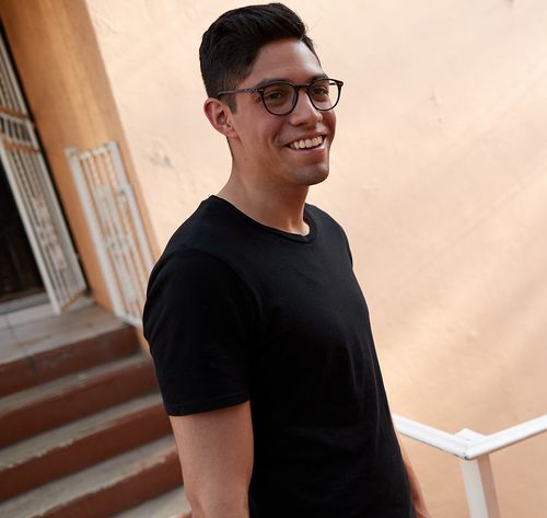 man smiling on staircase