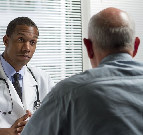 doctor with older patient