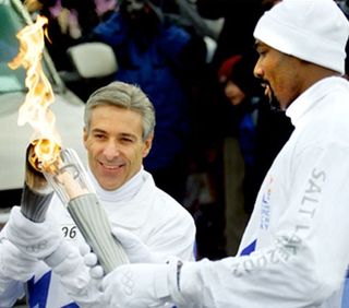 Dale Hull lighting the Olympic torch.