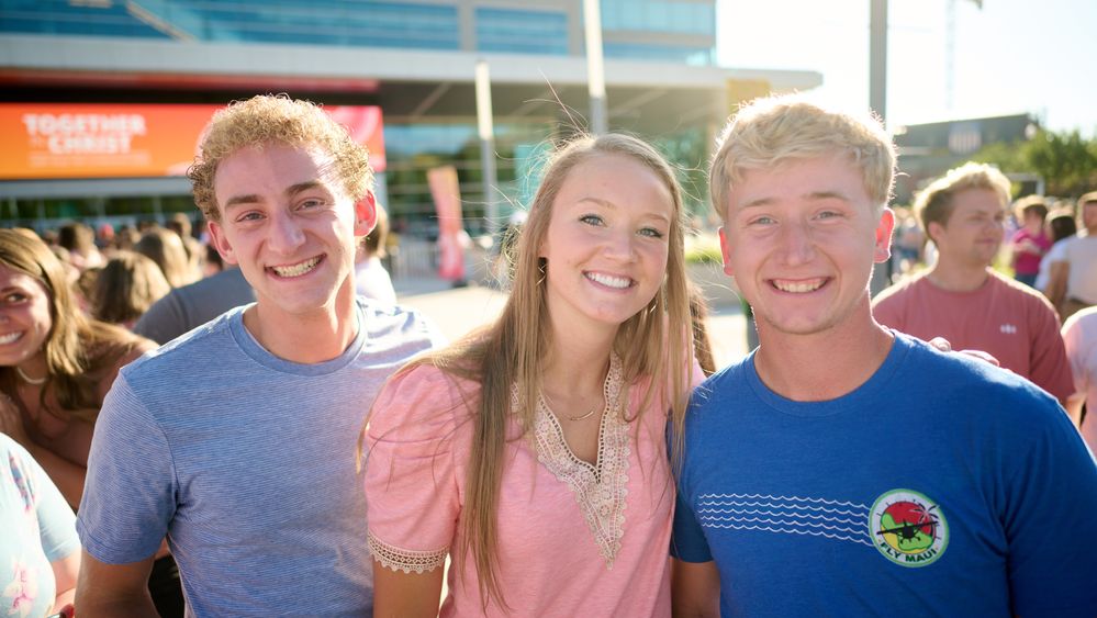 Young single adults gather together at the Delta Center in Salt Lake City to watch a "Together in Christ" concert featuring Jordan Sparks, Jordan Smith, and OneRepublic.