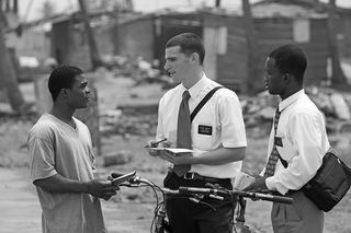 Missionaries talking to young man