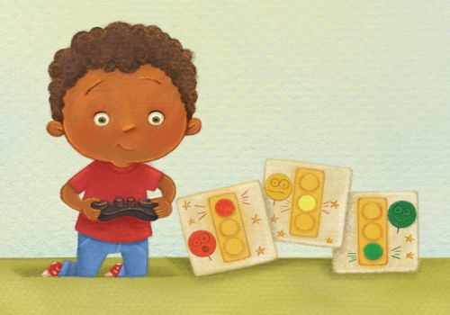 A boy holding a videogame controller next to drawings of a red, a yellow, and a green stoplight