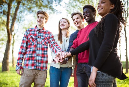 group of young adults standing together