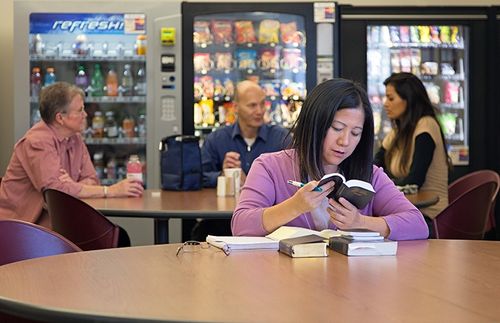 Woman reading in break room