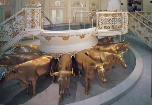 The baptistry in the Salt Lake Temple.  The view of the baptistry shows the baptismal font supported by twelve golden oxen, and the stairs leading to the font.