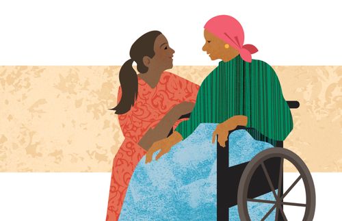 一位妇女安慰另一位坐轮椅的妇女