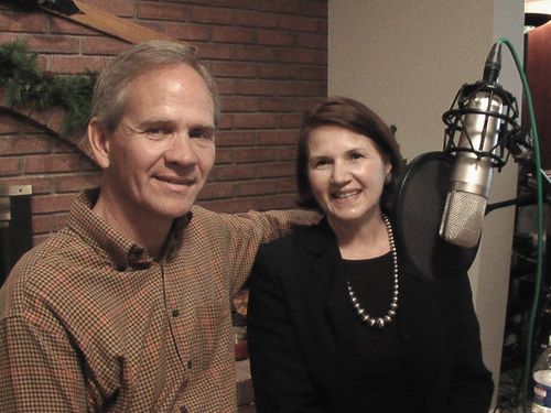 Ed and Lois Smart beside a radio microphone.