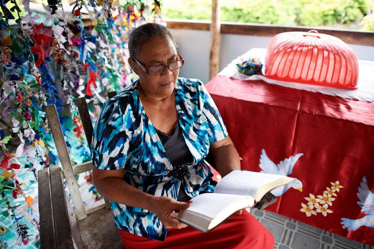 A woman reading the Book of Mormon