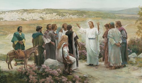 The resurrected Jesus Christ standing with the apostles outside the city of Jerusalem. Christ is dressed in white robes and has His arms extended as He speaks to the eleven apostles. Christ is commanding the apostles to preach the gospel to all nations. The city Jerusalem is visible in the background.