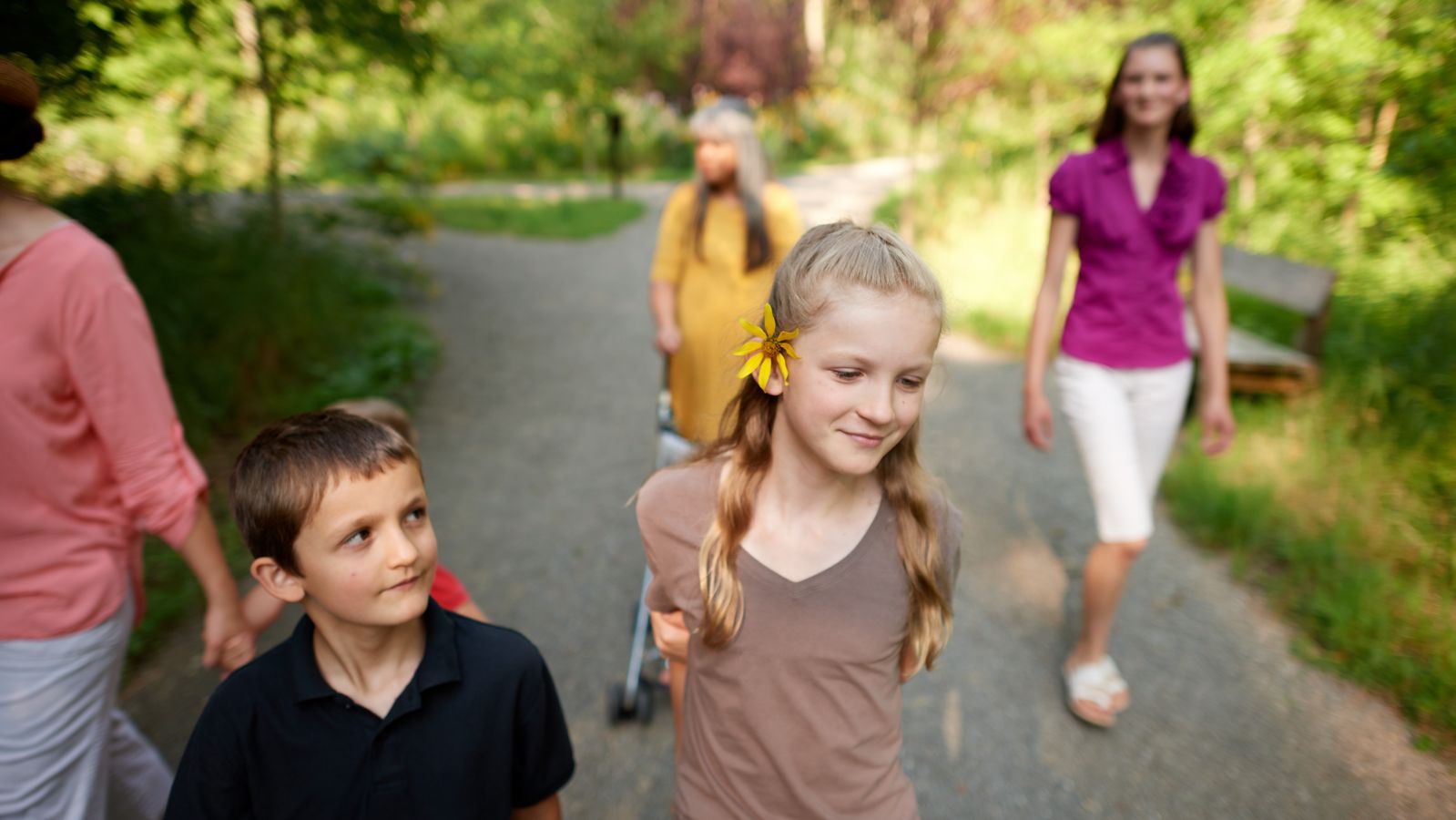 Exterior of woods near the Visitors' Center at the Priesthood Restoration Site near Susquehanna Depot, Pennsylvania.
A family goes walking on pathways nearby.