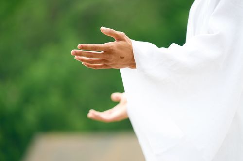 The resurrected Savior, Jesus Christ, appears to the ancient inhabitants of the Americas. His hands are outstretched to reveal the wounds in his hands.