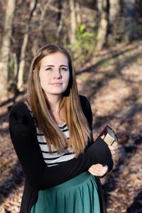 student holding the scriptures