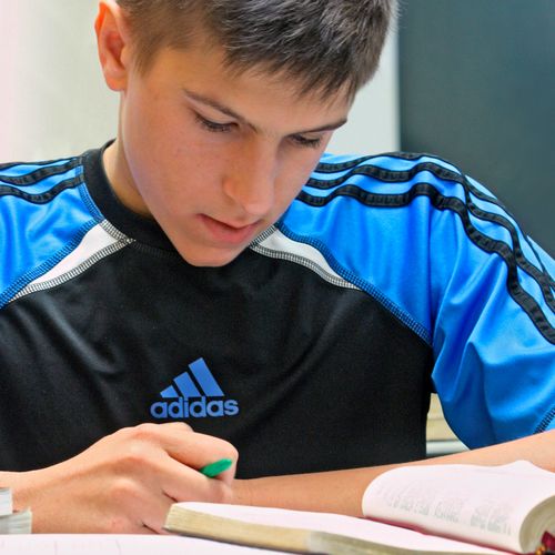 young man studying scriptures