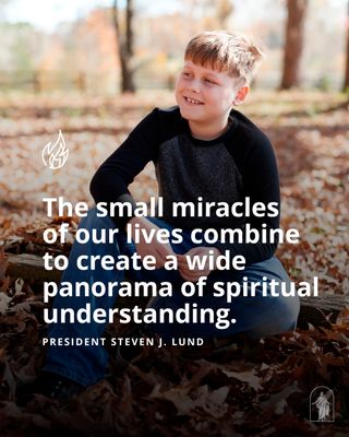 A family is outside together. There are a lot of leaves on the ground. This is in Alabama. A young man sits among the leaves on the ground.