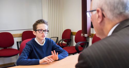 A young man meets with his Bishop.