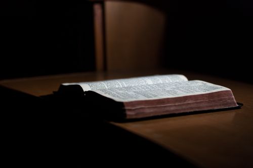 Scriptures resting on a table.