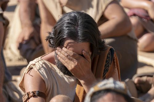 A Nephite man covers his face in guilt as he listens to Jacob teach about pride and chastity.