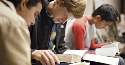 Youth studying the scriptures in their seminary class.