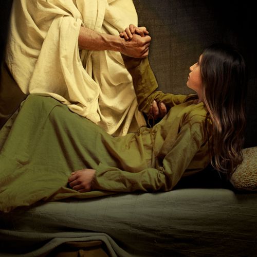 Photographic illustration of Jesus Christ healing the daughter of Jairus.   The image shows the figure (not the face) of Christ as he takes the young girl by the hand and assists her to rise from her sick bed.