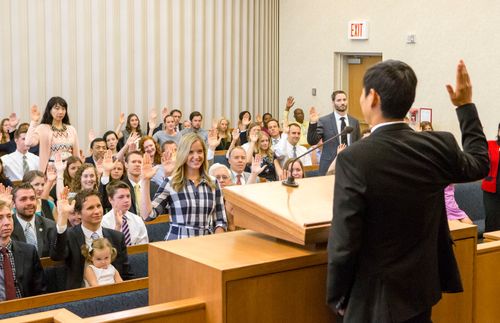 young man standing before a Church congregation