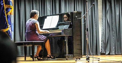 young woman playing piano