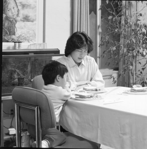 mother and son blessing food