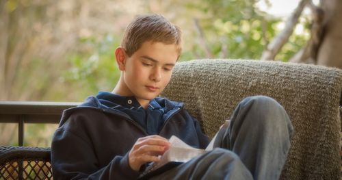 A young man reading scriptures.