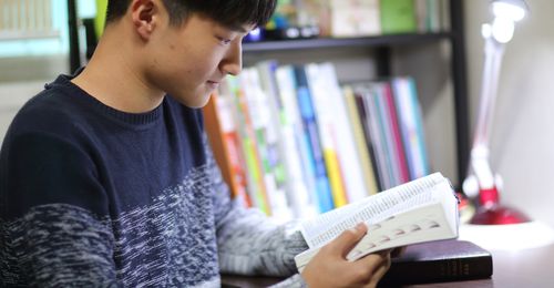 young man reading the scriptures