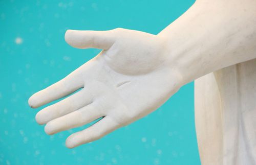 the hand of a Christus statue