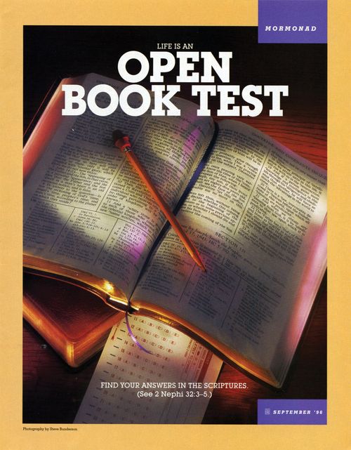 A set of scriptures lying open next to a test paper, paired with the words “Life Is an Open Book Test.”