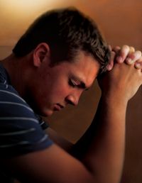 young man praying