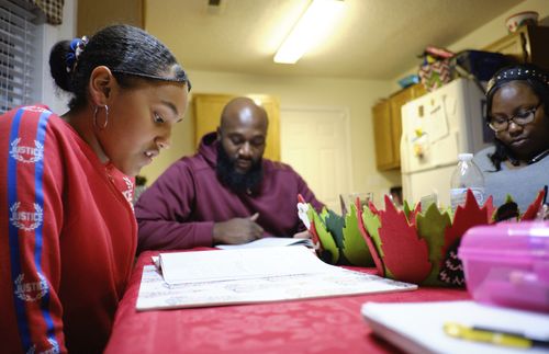 family studying scriptures