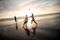 Series of images of youth playing rugby at the beach