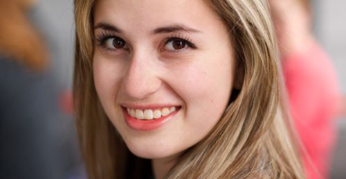 Informal portrait of a young woman at the General Women's Meeting, March 2014.