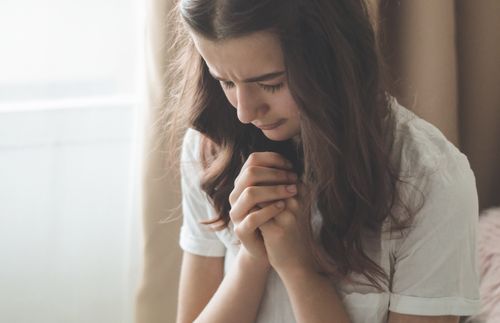 young woman praying