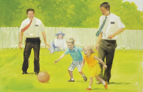 missionaries playing soccer with children