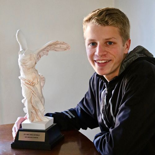 young man and trophy