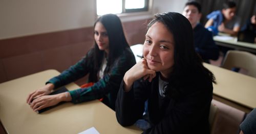 young women and young men in class