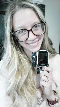 young adult woman holding medical device