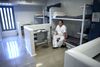 An inmate sits on a lower bunk on a bunkbed in a cell at a prison facility.   Special Services of the Priesthood department has requested that PSD capture images of various Correctional facilities that will be used on websites and curriculum targeted to spiritually support LDS members in correctional confinement and their families.