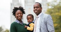 Pictures taken during the Sunday Afternoon Session of the 187th Semi-Annual General Conference. A family pauses in front of the Salt Lake Temple. Husband, wife, and a little girl.