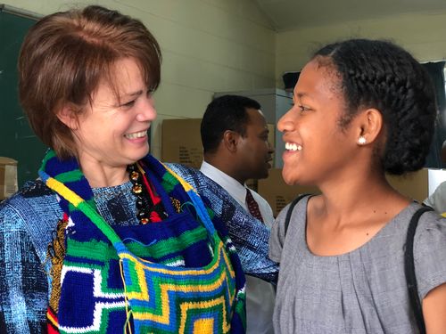 Sister Eubank talking to woman